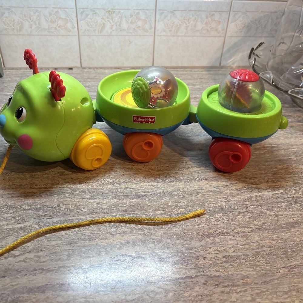 Vintage Fisher Price Roll a Rounds Pull and Spin Caterpillar 2005